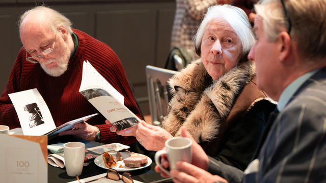 Audience reading the leaflets