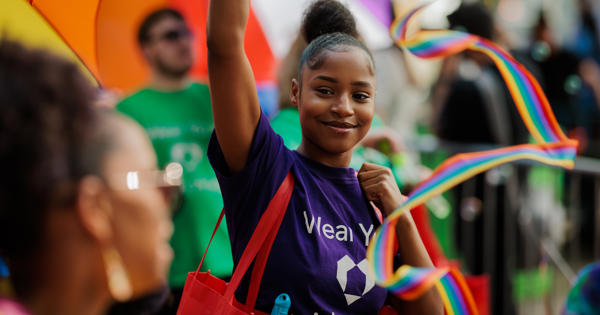 Woman in purple t-shirt in the Pride parade