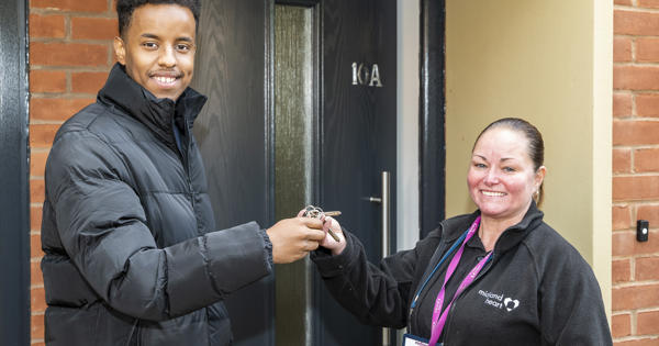 Midland Heart employee handing over keys to a new tenant