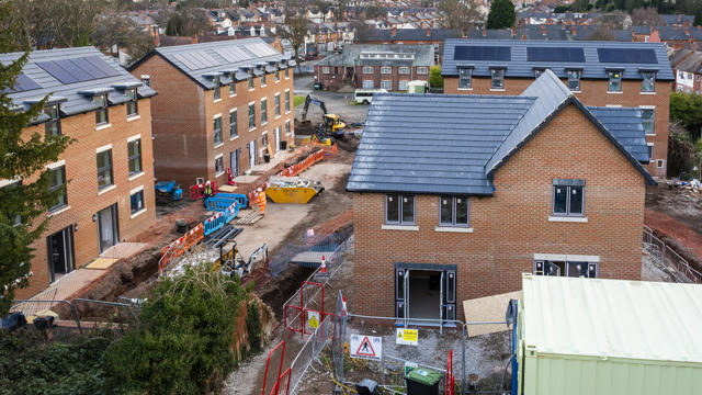 A view of the site with the houses built but internal and external work to be completed