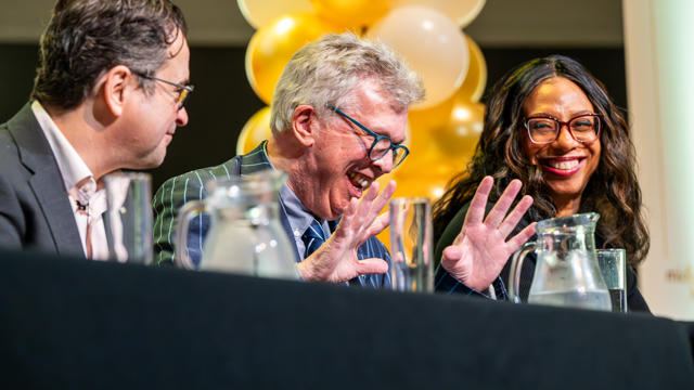 Panel speakers smiling