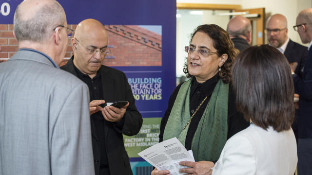 2 women and 2 men from the crowd speaking to one another