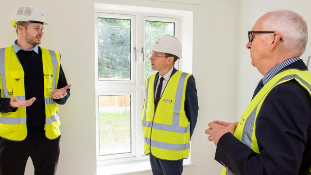 The Birmingham mayor speaking with the Midland Heart board chair and the project manager