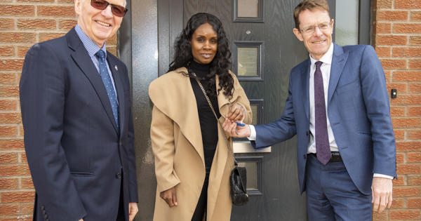 Board Chair and Birmingham Mayor with a tenant moving into their new home