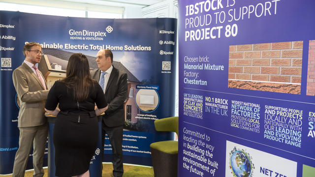 3 people having a chat in the GlenDimplex stand